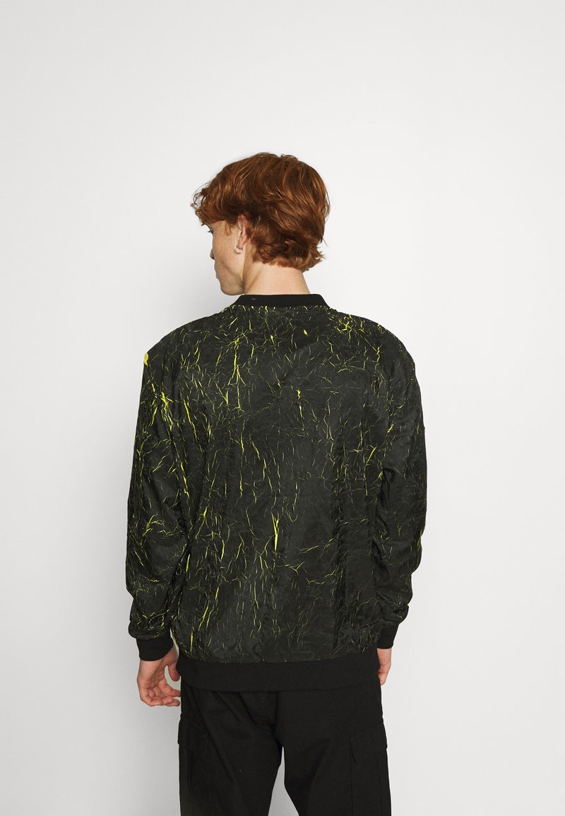 KARL KANI SMALL SIGNATURE NEON T-SHIRT